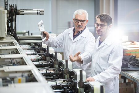 Explaining printing process to colleague