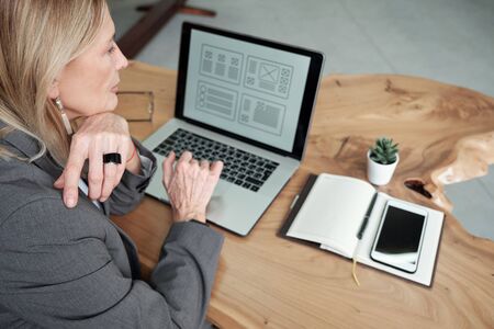 Business lady working on ui designの写真素材