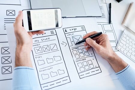 Horizontal high angle shot of unrecognizable software developer working on new application for...