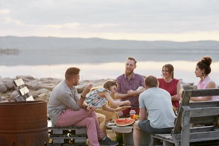 Friends Spending Evening Outdoorsの写真素材