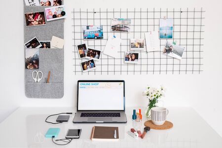 Workplace of contemporary female photographer or designer with supplies
