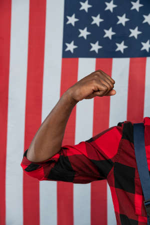 Contemporary repairman or engineer in workwear showing his strong armの写真素材