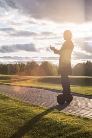 Outline of contemporary businessman in coat making selfie on gyroscopeの写真素材