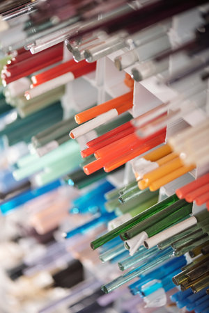Number of square shelves with long glass multi-color workpieces for lampworkingの写真素材