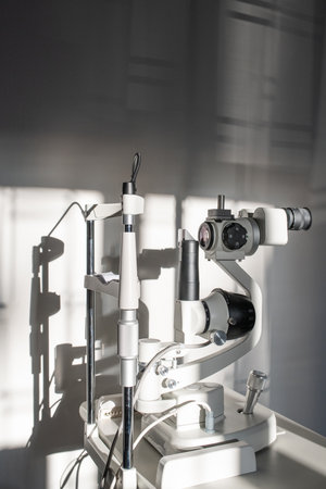 Ophthalmological diagnostic equipment on doctor workplace inside medical office