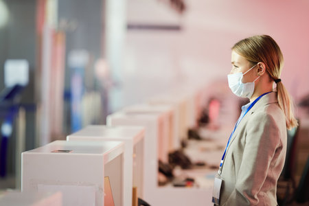 Airport worker at receptionの写真素材