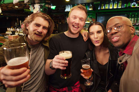 Young people drinking beerの写真素材