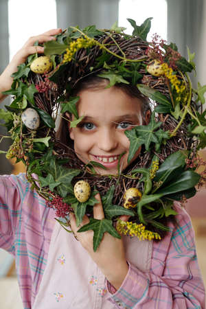 Little girl with flower wreathの写真素材