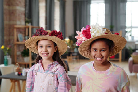 Little girls in beautiful hatsの写真素材