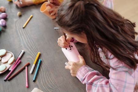 Girl making a craft at art class