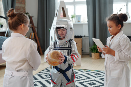 Group of children in costumes performing a play they playing astronauts