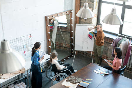 Fashion designers choosing colors for new collection at working meetingの写真素材
