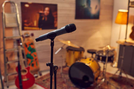 Microphone among musical instruments in sound recording studioの写真素材
