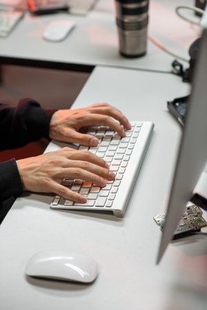 Hands of programmer or IT support manager working by deskの写真素材