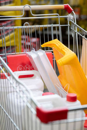 Pile of chosen household goods in shopping cartの写真素材