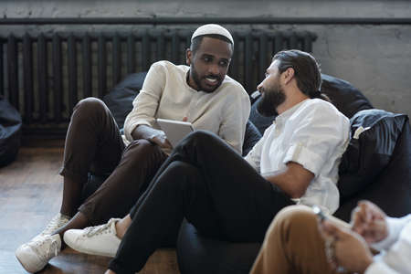 Two Muslim businessmen discussing working points at meetingの写真素材