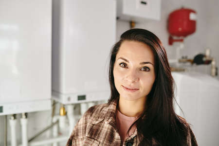 Young Caucasian brunette female looking at camera in home lavatoryの写真素材