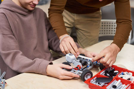 Cropped shot of unrecognizable boy building electric car in robotics and engineering class at school, copy spaceの写真素材