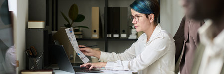 Banner of young female trader with financial paper typing on laptop keypad while analyzing...