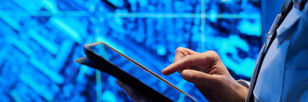 Header of hand of female officer in uniform pointing at screen of tablet while standing in front of...