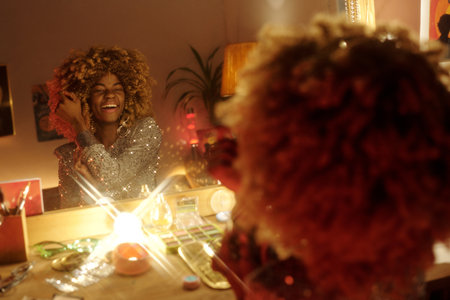 Smiling Woman with Curly Hair in Front of Mirror