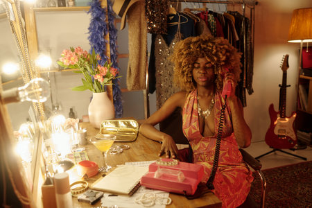 Talking on Rotary Phone at Glamorous Vanity
