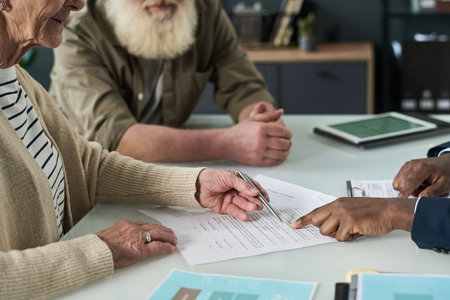 Senior Woman Signing Agreement With Managerの写真素材