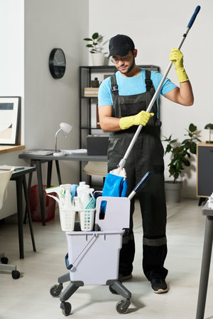 Man Washing Floor In Officeの写真素材
