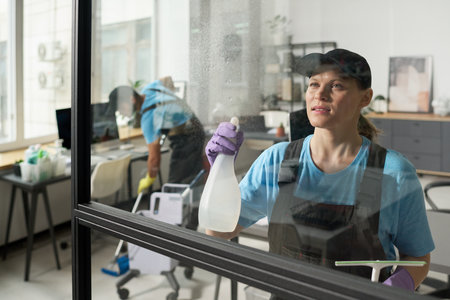 Workers From Cleaning Service Working In Office