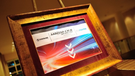 Event poster at the launch of new Mazda CX-5 crossover SUV in Singapore on 13 April 2012