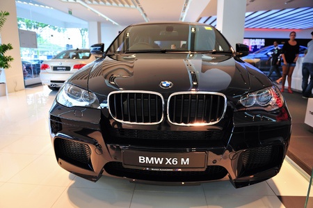 Static display of BMW X6 M at Munich Automobiles BMW Service Centre Open House on May 21, 2011 in Singaporeのeditorial素材