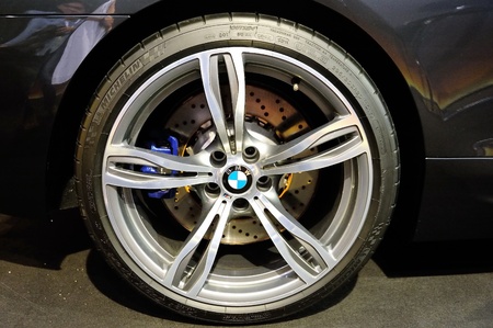 Large wheel alloy and carbon ceramic brake of BMW M6 Convertible at its Preview at Singapore Yacht Show April 28, 2012 in Singaporeのeditorial素材