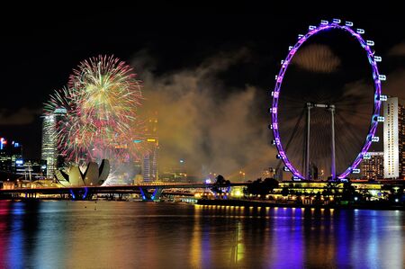 Fireworks display captured with Marina Bay city scape during National Day Parade 2012 Rehearsal on July 21, 2012 in Singaporeのeditorial素材