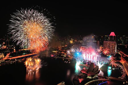 Aerial view of fireworks display with Marina Bay city scape during National Day Parade 2012 Preview on August 04, 2012 in Singaporeのeditorial素材