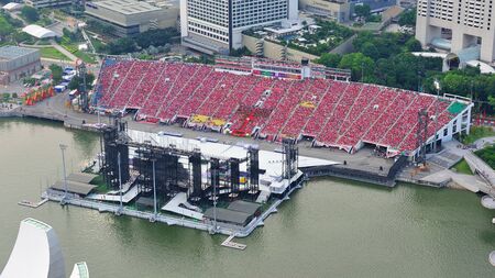 Sea of audience dressed in red to celebrate Singapore's National Day 2012 at the Marina Bay Floating Platform on 04 Aug 2012のeditorial素材