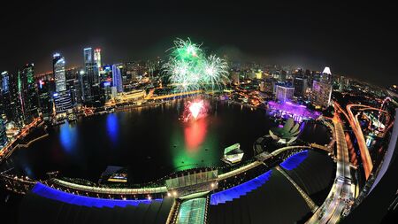 Aerial view of fireworks display with Marina Bay city scape during National Day Parade 2012 Preview on August 04, 2012 in Singaporeのeditorial素材