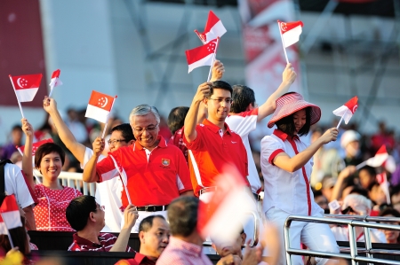 Ministers of State entering the gallery and waving flags during National Day Parade 2012 on August 09, 2012 in Singaporeのeditorial素材