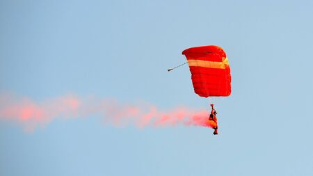 The Red Lions parachuting display during National Day Parade 2012 on August 09, 2012 in Singapore のeditorial素材