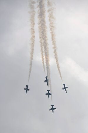 Bombe aerobatics maneuver by Breitling Jet Team at Sentosa Siloso Beach March 9, 2013 in Singaporeのeditorial素材