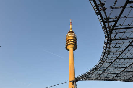 Olympiaturm television tower rising above Olympiapark in Munich, Germanyのeditorial素材