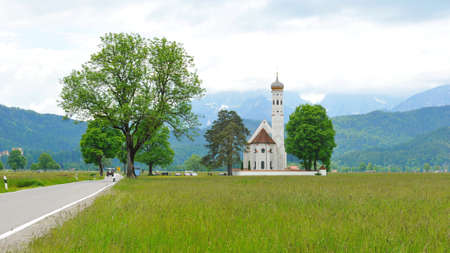 St Colomon church of Bavaria with the alps in the backgroundの写真素材