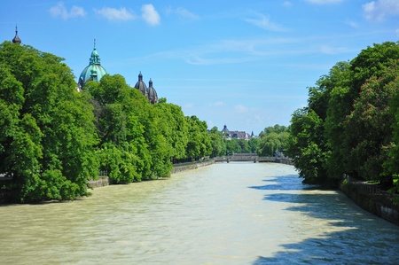 Row of trees along Isar river in Munich, Germanyの写真素材