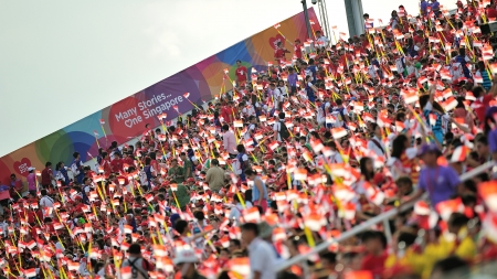 SINGAPORE - JULY 20  Spectators waving Singapore flags during National Day Parade  NDP  Rehearsal 2013 on July 20, 2013 in Singaporeのeditorial素材