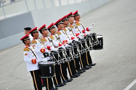 SINGAPORE - JULY 20: Singapore Armed Forces (SAF) band drummers performing during National Day Parade (NDP) Rehearsal 2013 on July 20, 2013 in Singaporeのeditorial素材