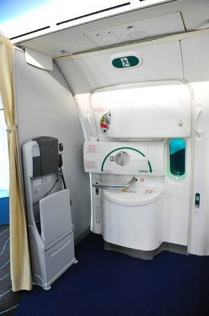 SINGAPORE - FEBRUARY 12  Door and flight attendant seat in a Boeing 787 Dreamliner at Singapore...