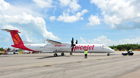 SINGAPORE - FEBRUARY 12  Spicejet s Bombardier Q400 regional aircraft being towed to position at Singapore Airshow February 12, 2012 in Singaporeのeditorial素材