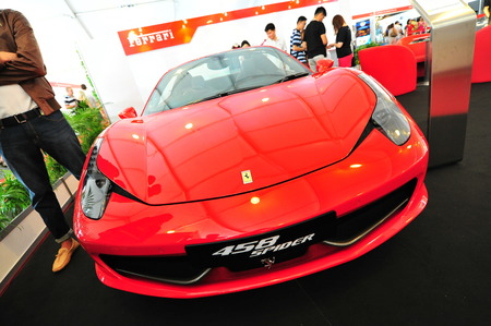 SINGAPORE - APRIL 12: Ferrari 458 Spider convertible sport car on display during Singapore Yacht Show at One Degree 15 Marina Club Sentosa Cove April 12, 2014 in Singaporeのeditorial素材