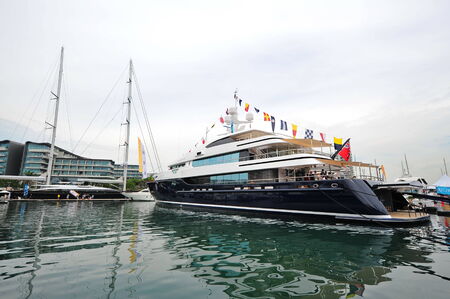 SINGAPORE - APRIL 12: Burgess Cloud 9 super yacht making its Asian debut during Singapore Yacht Show at One Degree 15 Marina Club Sentosa Cove April 12, 2014 in Singaporeのeditorial素材