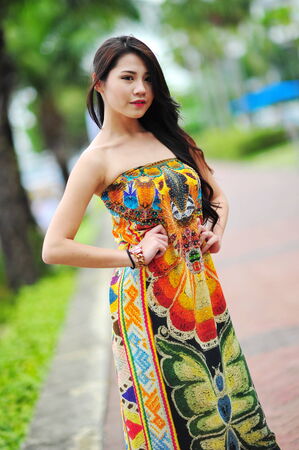 SINGAPORE - APRIL 12: Model showcasing vibrant and luxurious designs by Camilla (with Wattletree) during Singapore Yacht Show fashion event at One Degree 15 Marina Club Sentosa Cove April 12, 2014 in Singaporeのeditorial素材