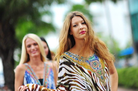 SINGAPORE - APRIL 12: Model showcasing vibrant and luxurious designs by Camilla (with Wattletree) during Singapore Yacht Show fashion event at One Degree 15 Marina Club Sentosa Cove April 12, 2014 in Singaporeのeditorial素材